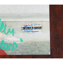 Load image into Gallery viewer, FRAMED 23” X 17” OUTSIDE THE WONKA FACTORY - AUTOGRAPHED BY FOUR